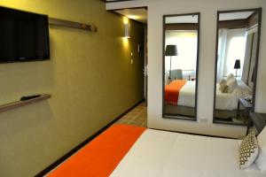 Postel nebo postele na pokoji v ubytování Hotel ACA El Calafate