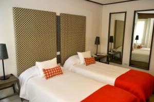 Postel nebo postele na pokoji v ubytování Hotel ACA El Calafate