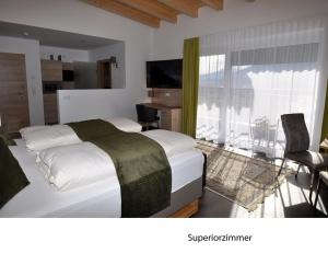 Postel nebo postele na pokoji v ubytování Hotel Martina