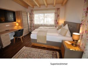 Postel nebo postele na pokoji v ubytování Hotel Martina