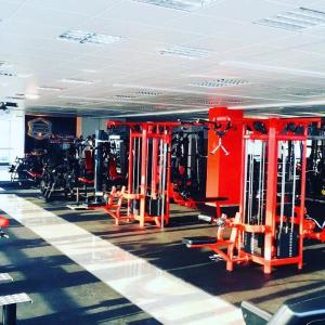 a gym with red equipment in a room at OC Panorama in Velké Meziříčí