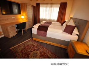 Postel nebo postele na pokoji v ubytování Hotel Martina