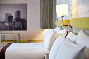 Postel nebo postele na pokoji v ubytování Fullon Hotel Kaohsiung