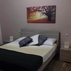 Un pat sau paturi într-o cameră la Relais al borgo
