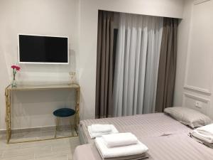 Postel nebo postele na pokoji v ubytování Onira luxury rooms