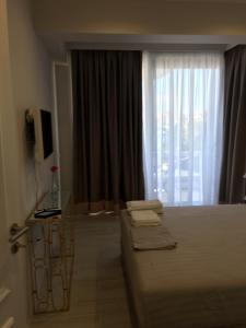 TV a/nebo společenská místnost v ubytování Onira luxury rooms