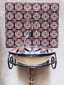 a bath tub in front of a wall with a tile at HaBaitBe Matityahu By Domus in Beer Sheva