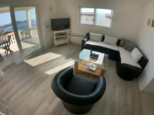 TV a/nebo společenská místnost v ubytování Apartment Sea & Mountain
