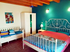 a bedroom with a bed and a blue wall at Villa Magnolia in Radanovići +34 photos