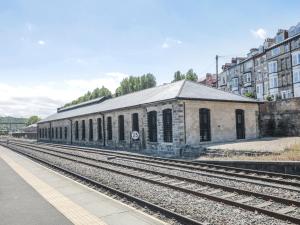 an old train station on the tracks in a city at Olton Hall Engine Shed in Whitby