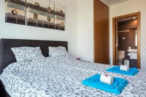 Postel nebo postele na pokoji v ubytování Jie Apartment