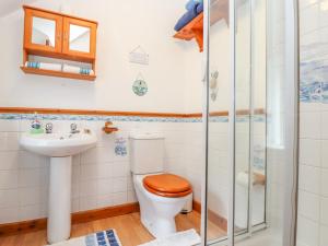 a bathroom with a toilet and a sink at Lighthouse in Penzance +21 photos