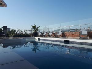 a swimming pool on the roof of a building at Silken Ramblas in Barcelona