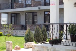 a house with plants in the front yard at Sea View Vama Veche in Vama Veche