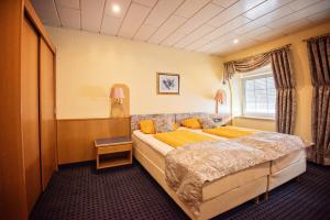 Кровать или кровати в номере Hotel Heideparadies