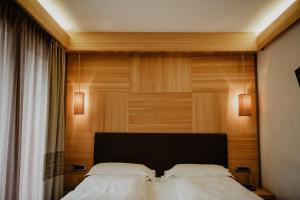 Postelja oz. postelje v sobi nastanitve Hotel Larice