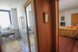 a room with a door leading to a bedroom at Quinta da Aldeia de Avanca in Avanca