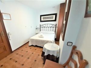 Posteľ alebo postele v izbe v ubytovaní Hostal Kokkola