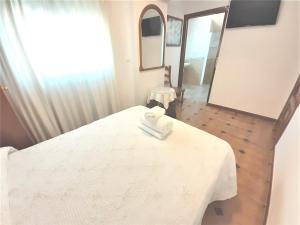 Posteľ alebo postele v izbe v ubytovaní Hostal Kokkola