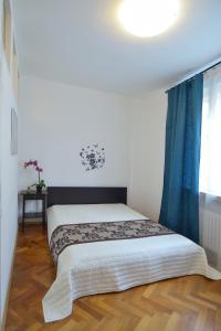 Postel nebo postele na pokoji v ubytování Modern Apartment Navrátilova II