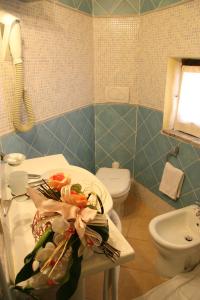 Een badkamer bij Hotel Le Dune