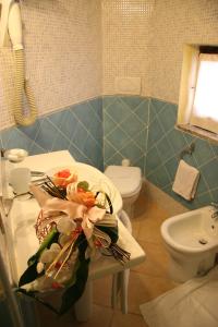 Een badkamer bij Hotel Le Dune