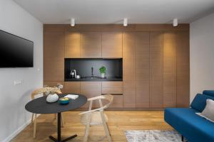 Televízia a/alebo spoločenská miestnosť v ubytovaní Luxury Town House Corto Bechera