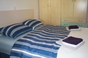 Ein Bett oder Betten in einem Zimmer der Unterkunft Apartman Antonia