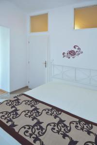 a bedroom with a bed with a black and white bedspread at Modern Apartment Navrátilova II in Prague