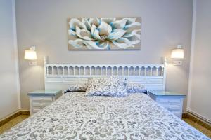 Ένα ή περισσότερα κρεβάτια σε δωμάτιο στο Hosteria El Capricho