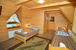 Кровать или кровати в номере Pod Gorcami