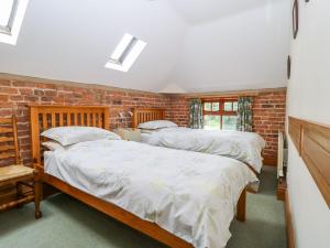 A bed or beds in a room at Barn Owl