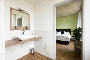 Postel nebo postele na pokoji v ubytování Partner Hotel AG Zofingen