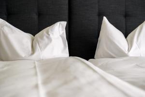 Postel nebo postele na pokoji v ubytování Partner Hotel AG Zofingen