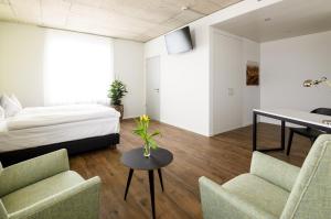Postel nebo postele na pokoji v ubytování Partner Hotel AG Zofingen