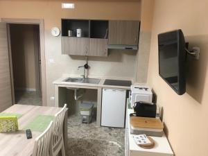 Kuchyň nebo kuchyňský kout v ubytování B&B Amores