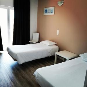 Postel nebo postele na pokoji v ubytování Hotel Eira Da Pedra