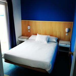 Postel nebo postele na pokoji v ubytování Hotel Eira Da Pedra