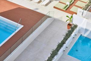 The swimming pool at or close to HM Dunas Blancas