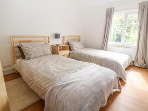 Ένα ή περισσότερα κρεβάτια σε δωμάτιο στο Well House Farm Flat 2