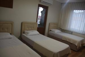 Postel nebo postele na pokoji v ubytování Gün Apart