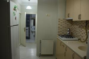 Kuchyň nebo kuchyňský kout v ubytování Gün Apart