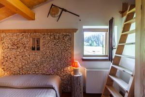 Postel nebo postele na pokoji v ubytování Albergo Lozen