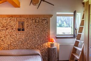 Postel nebo postele na pokoji v ubytování Albergo Lozen