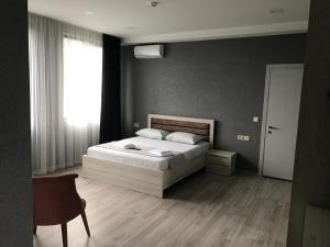 Voodi või voodid majutusasutuse Hotel FLEUR DE LIS toas