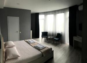 Voodi või voodid majutusasutuse Hotel FLEUR DE LIS toas