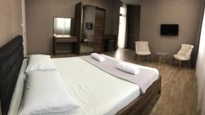 Voodi või voodid majutusasutuse Hotel FLEUR DE LIS toas