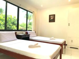 Postel nebo postele na pokoji v ubytování Luna Oslob Travellers Inn + 37 fotografií