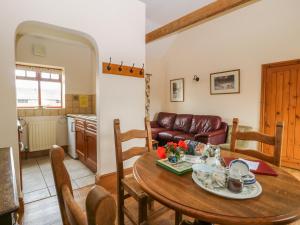 a living room with a table and a couch at Ticklepenny in Louth