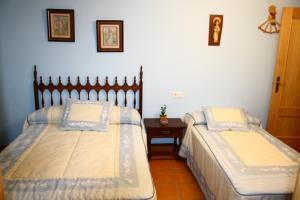 Postel nebo postele na pokoji v ubytování Los Olivos
